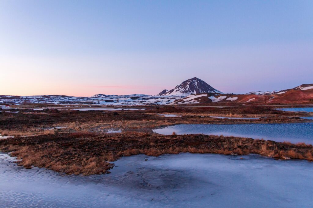 Serene Snow-Capped Mountain Over Frozen Lake